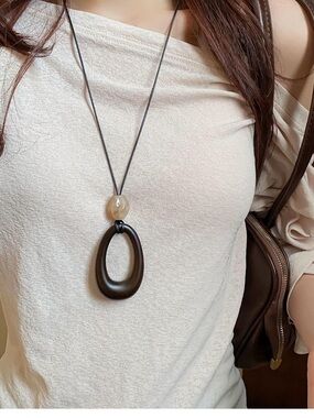 Long Black Teardrop Pendant Necklace with Beige Accent